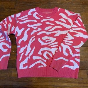 Vibrant Pink Sweater with White Patterns